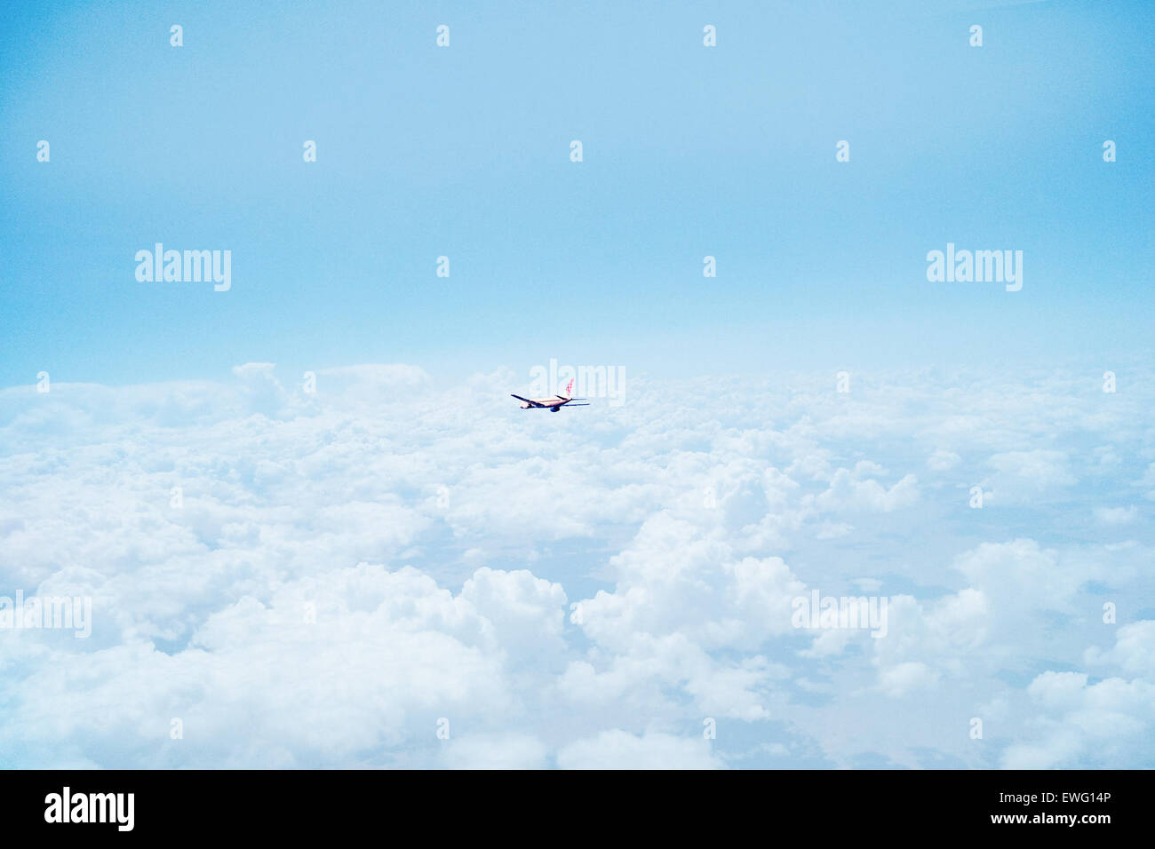 Airplane above clouds hi-res stock photography and images - Alamy