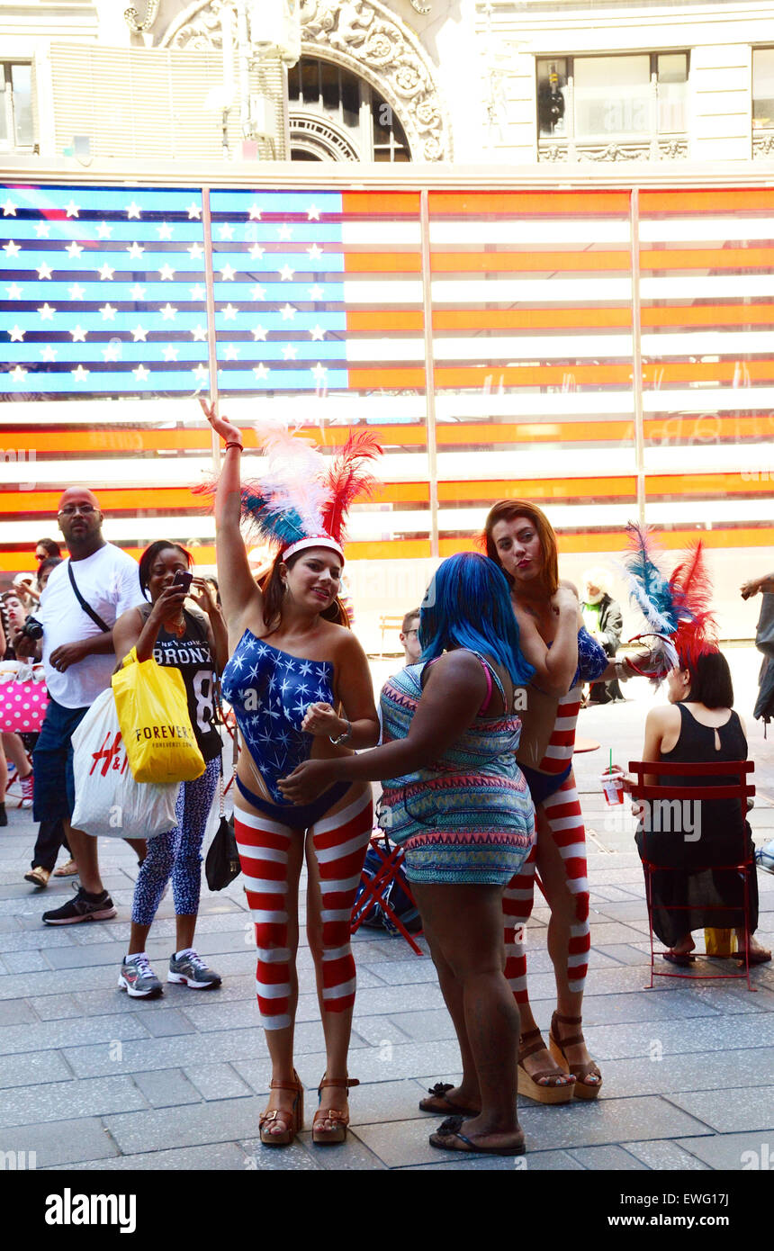 NEW YORK-MAY 20: A Pretty Lady In Patriotic Red, White And Blue Body Paint  Looks For Tips From Tourists With Cameras In Times Square On May 20 2014 In  Manhattan. Stock Photo