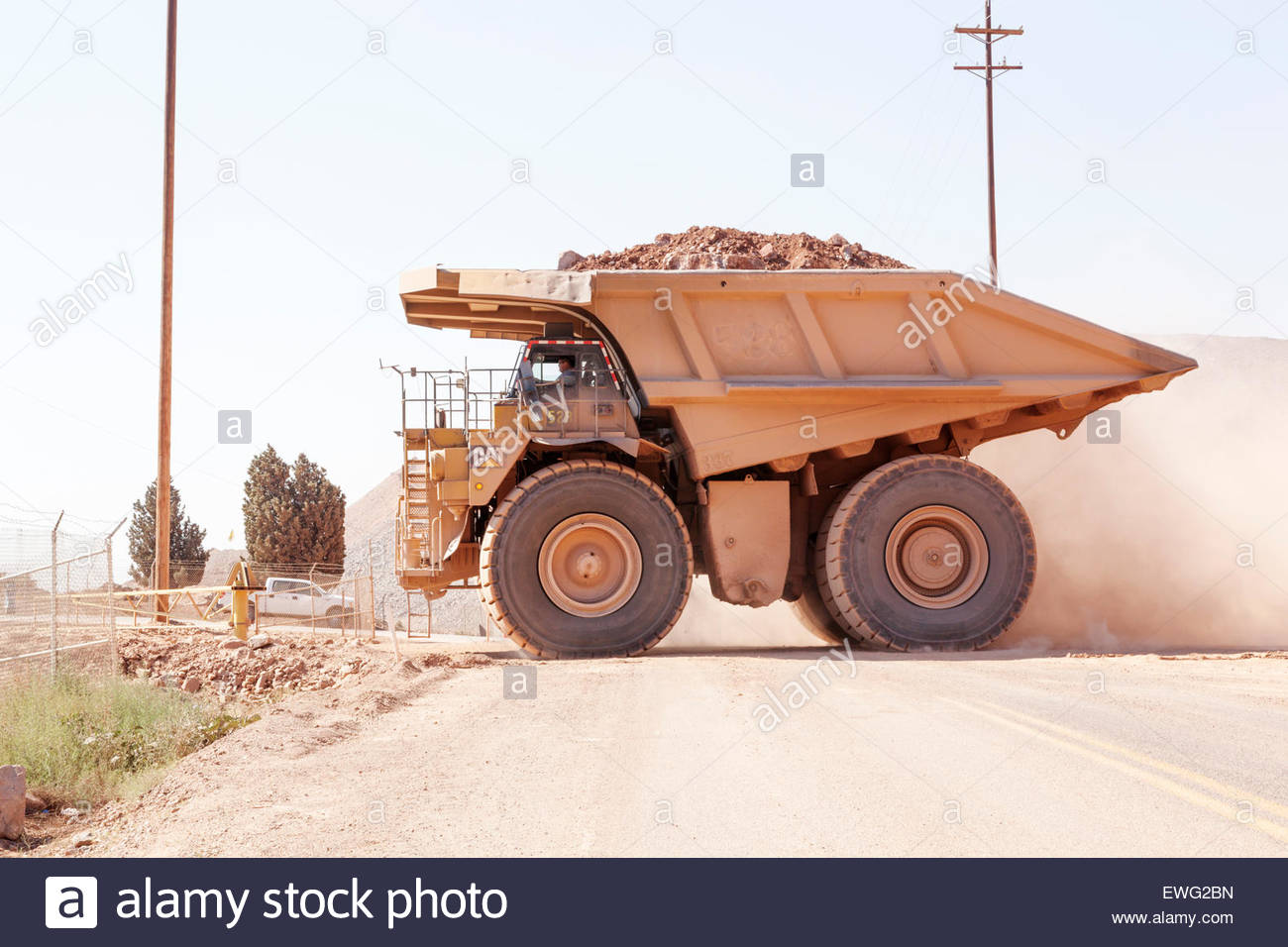 Mine haul truck Caterpillar 793B 240 ton capacity crossing highway