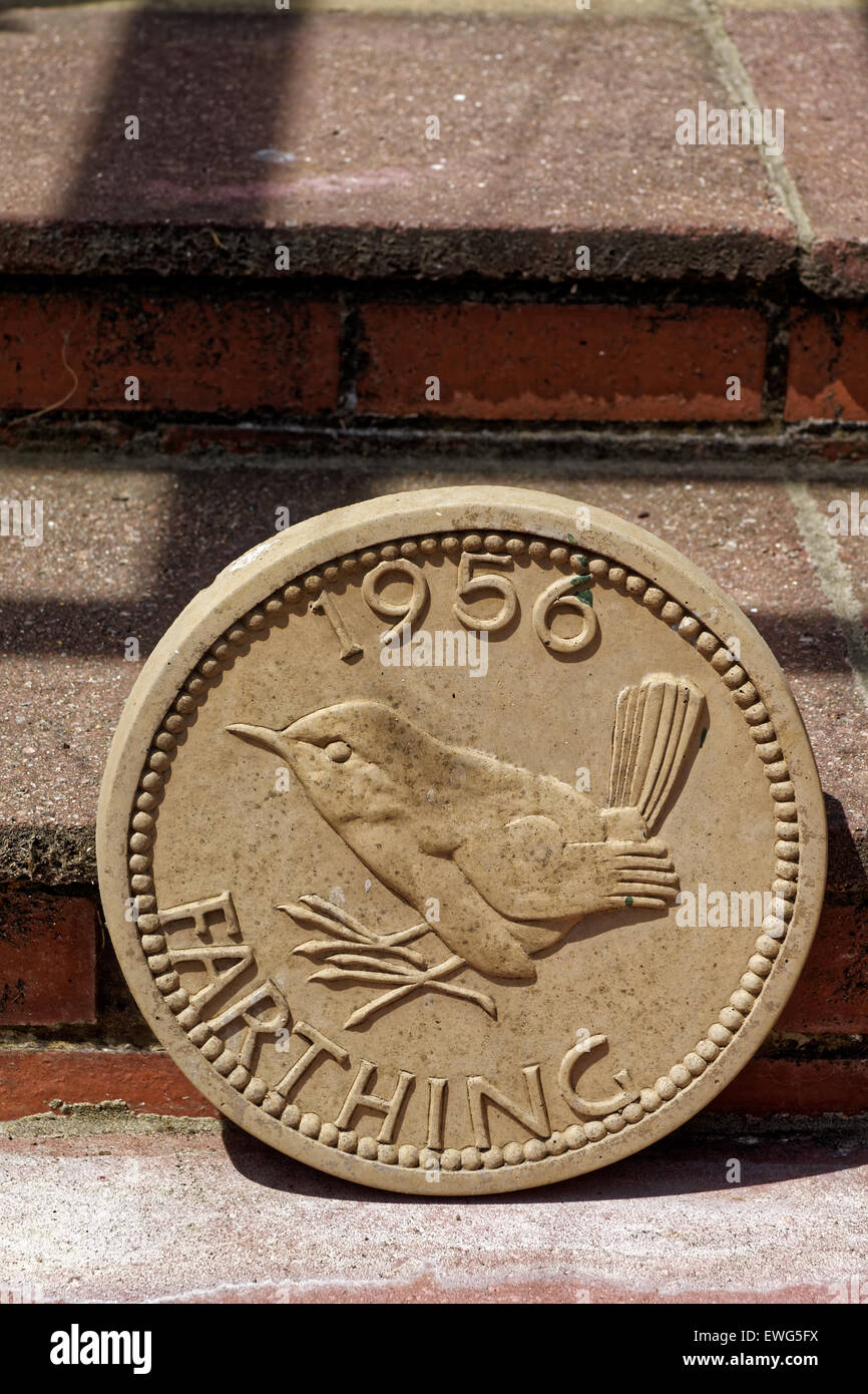 Replica farthing coin garden ornament Stock Photo