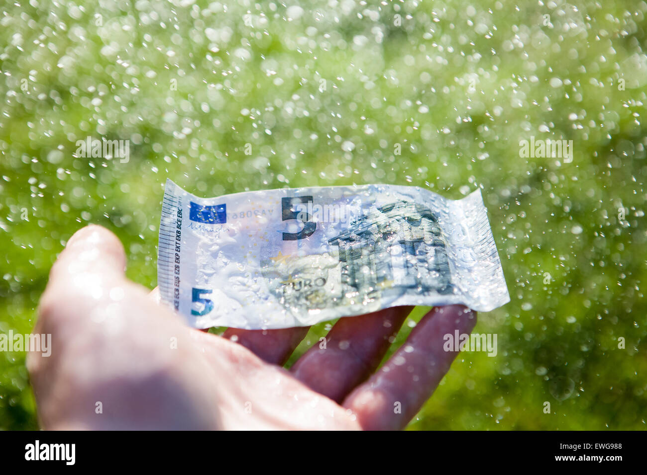 Money laundering in the rain Stock Photo