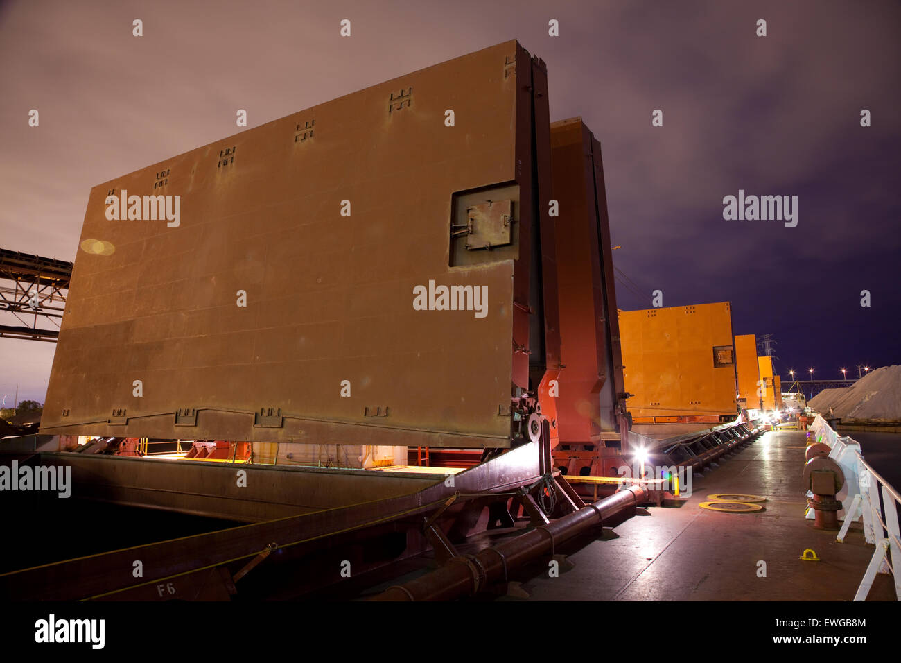 bulk ship with hatch covers open at night Stock Photo