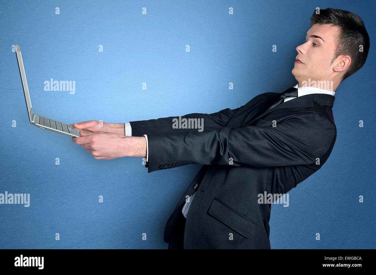 Business man with laptop speed concept Stock Photo - Alamy