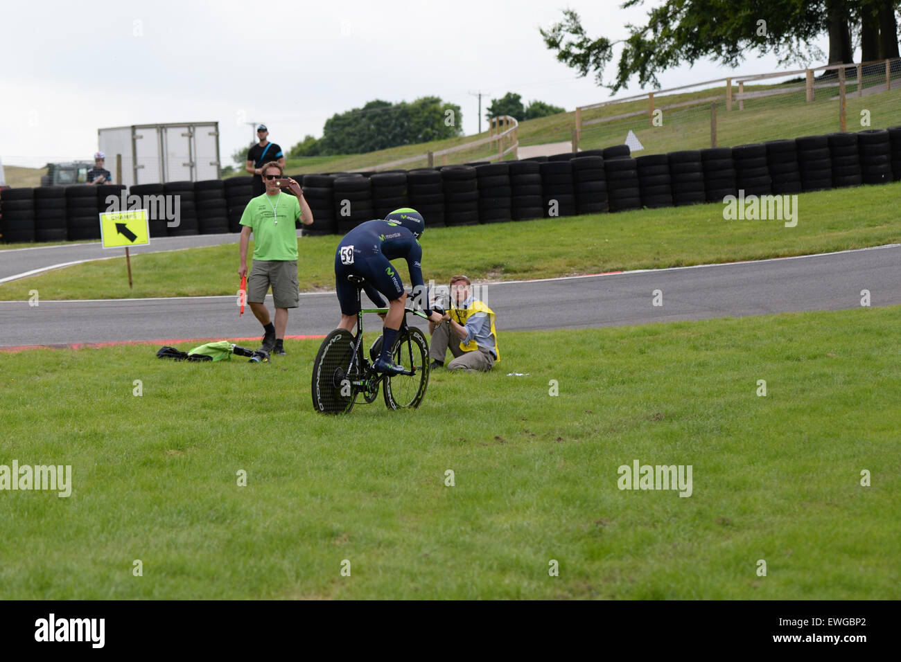 Lincoln, UK. 25th June, 2015. Alex Dowsett overshoots a corner at the British Cycling Time Trial Championships at Cadwell Park near Lincoln, United Kingdom on 25 June 2015. Dowsett won the race by over three minutes. Credit:  Andrew Peat/Alamy Live News Stock Photo