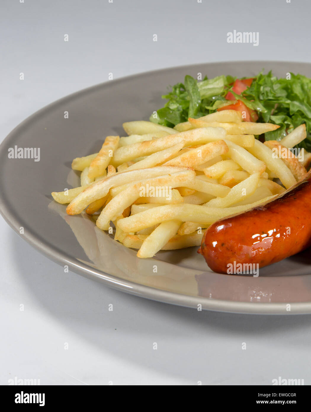 Sausage and French Fries Stock Photo