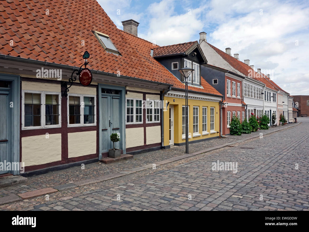 Restaurant Under Lindetraeet And Houses In Ramsherred Odense Denmark Stock Photo Alamy
