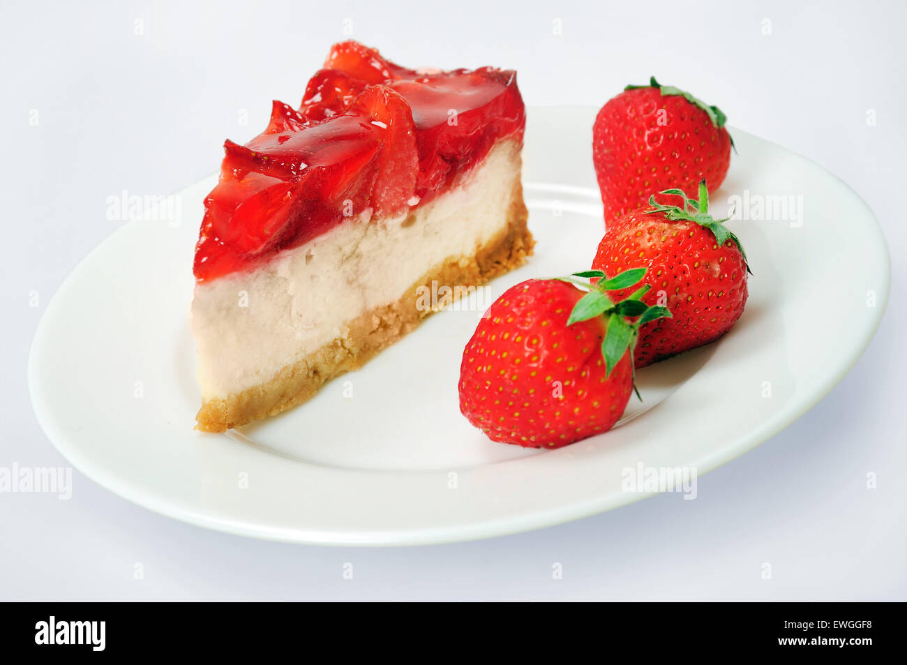 Cake with strawberry on grey background Stock Photo - Alamy