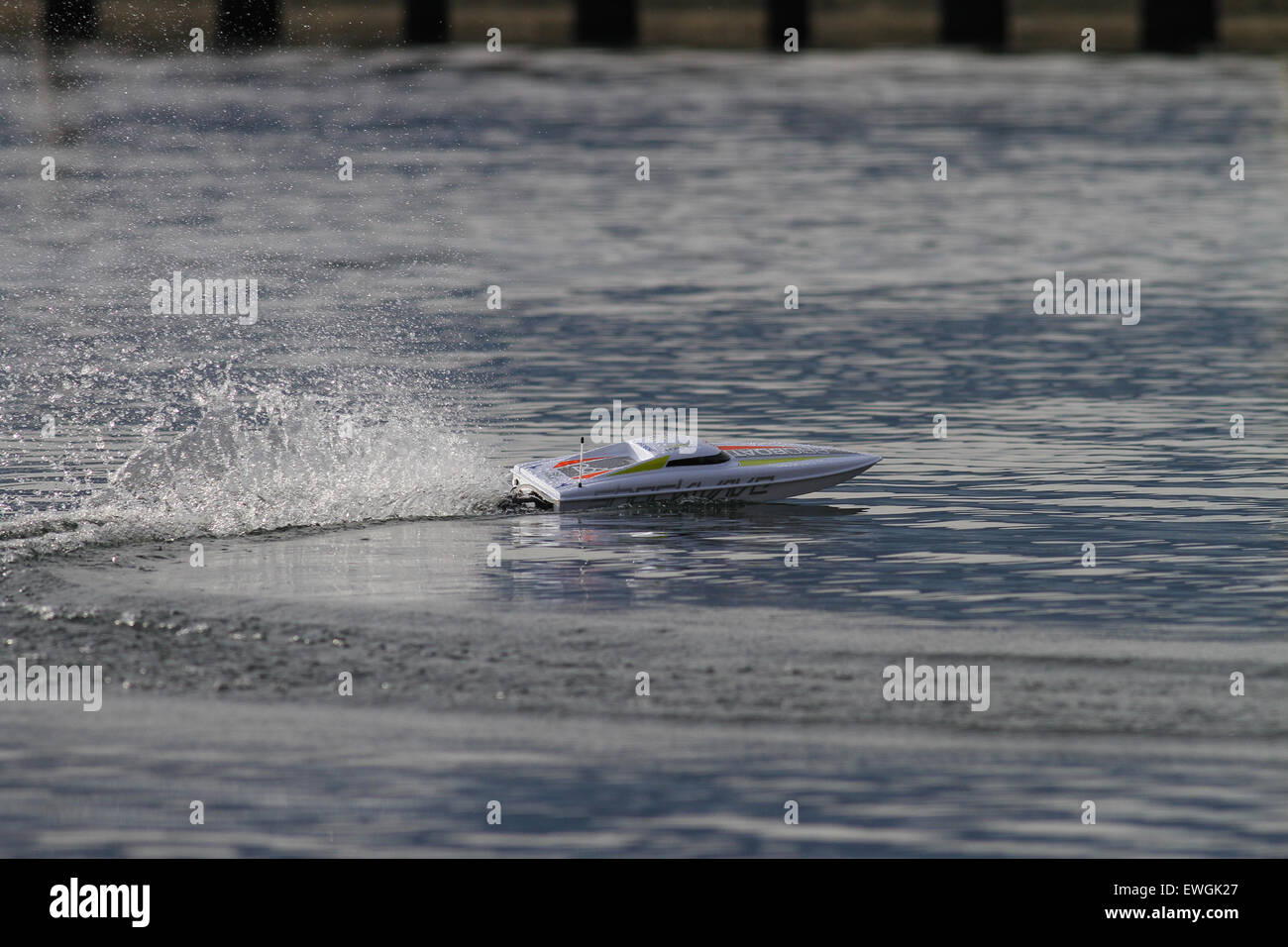 RC remote controlled power boat racing on a lake Stock Photo