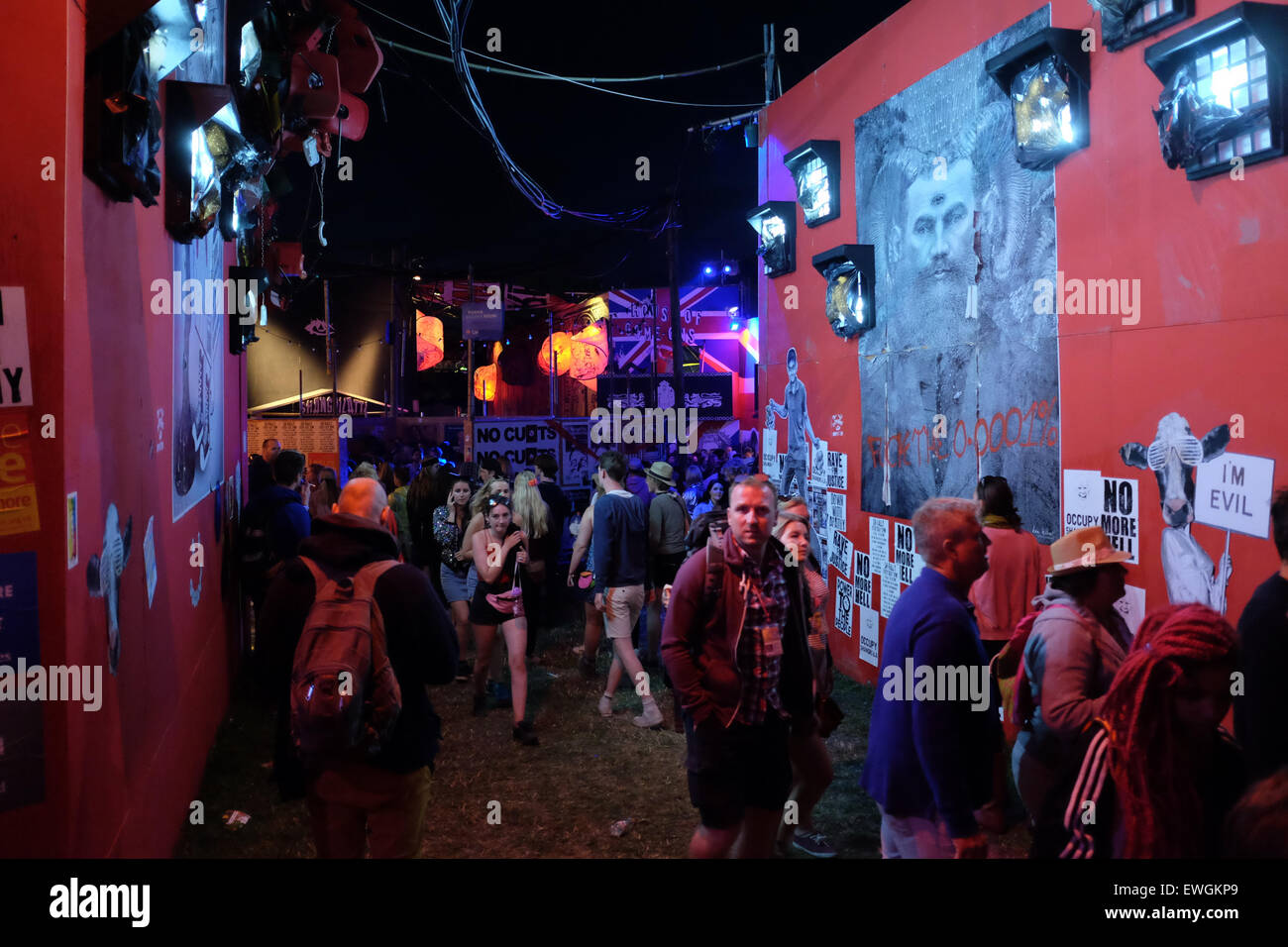 Glastonbury Festival, Somerset, UK. 25 June 2015. As night falls revellers make their way to the south west corner of the Festival site where they find Shangri-La. Shangri-La, described as a shimmering ephemeral city that appears magically once a year, is based on a dystopian pleasure city that was destroyed. It is Hell, Purgatory and Heaven all rolled into one. Credit:  Tom Corban/Alamy Live News Stock Photo