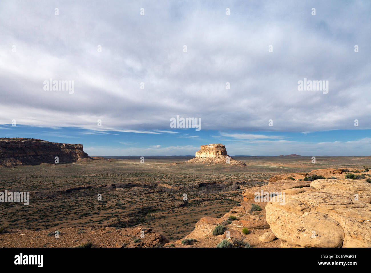 The 380 foot tall Fajada Butte rises above the valley floor in Chaco Culture National Historic Park. Stock Photo