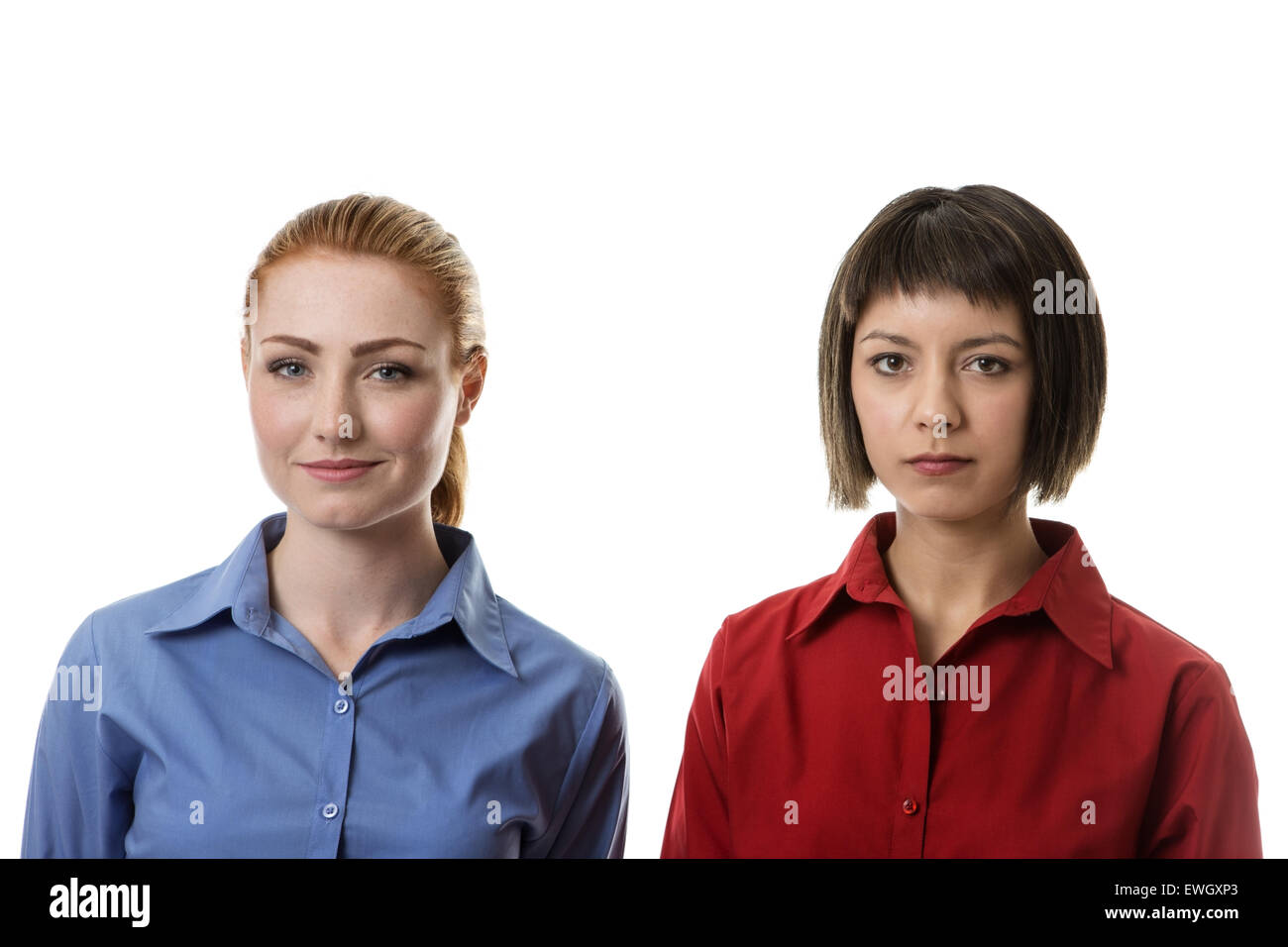two business woman with different face expressions sanding side by side with contempt on ther face Stock Photo