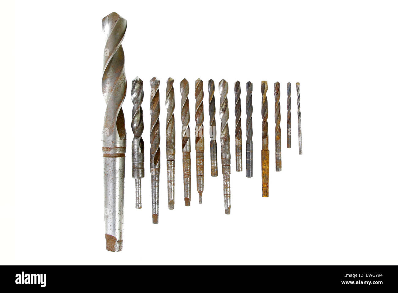leader group of vintage rusted drill bits metal wood on white background Stock Photo