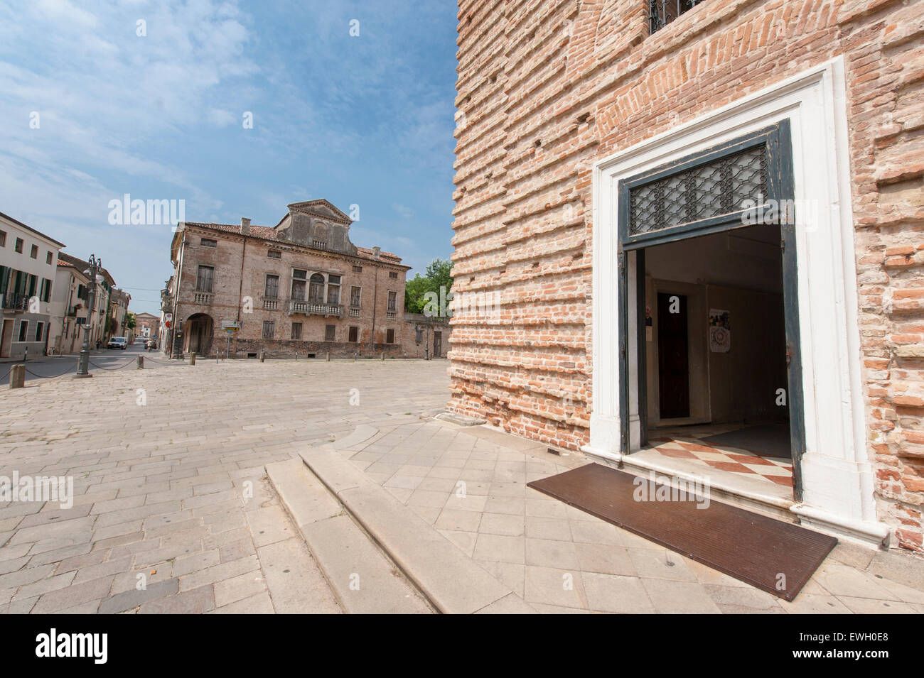 Via Principe Umberto Uno with the Palazzo del Municipio and the gate of Santa Maria delle Grazie in Este, Veneto, Italy Stock Photo