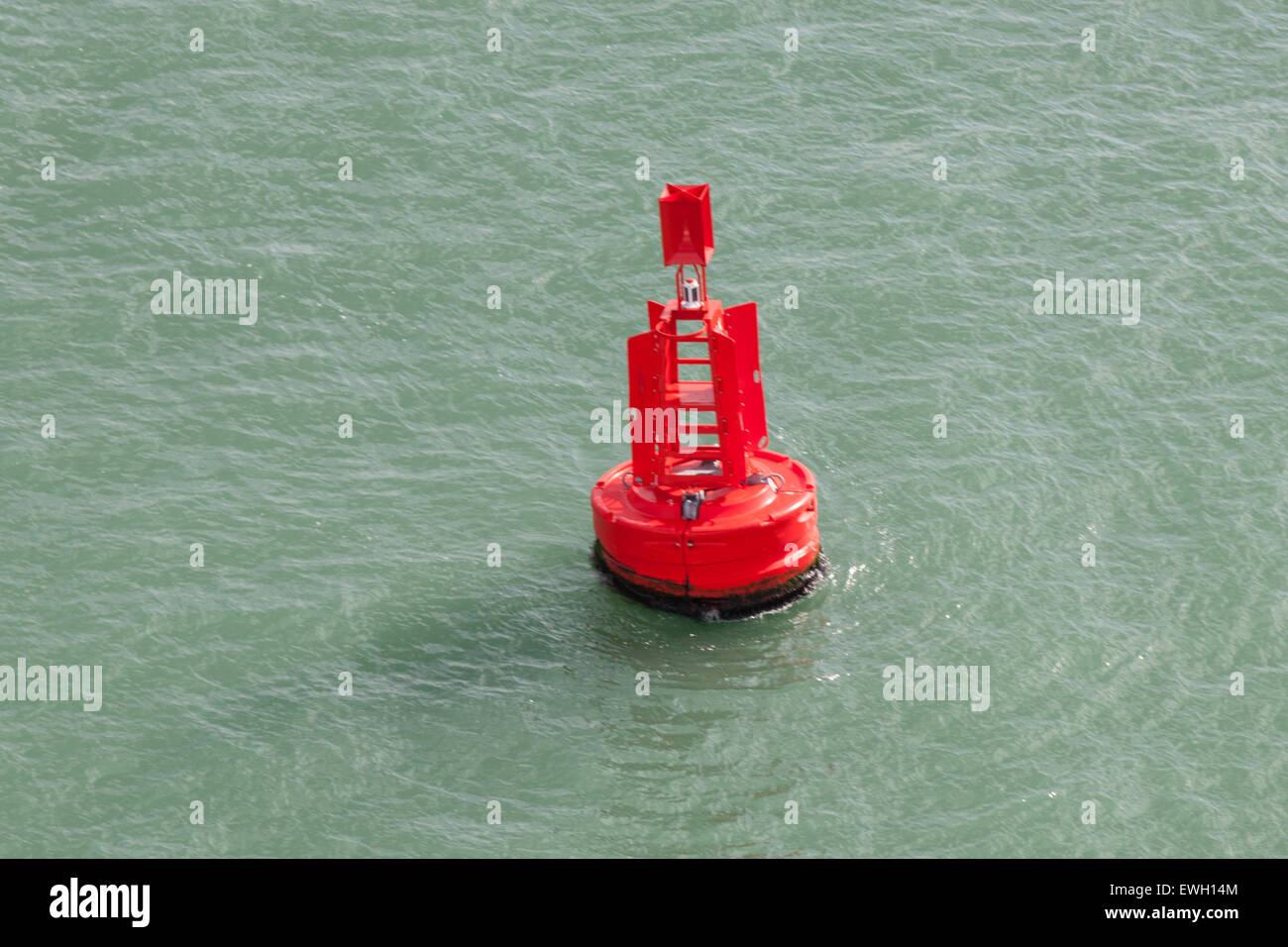Red Buoy in the ocean Stock Photo