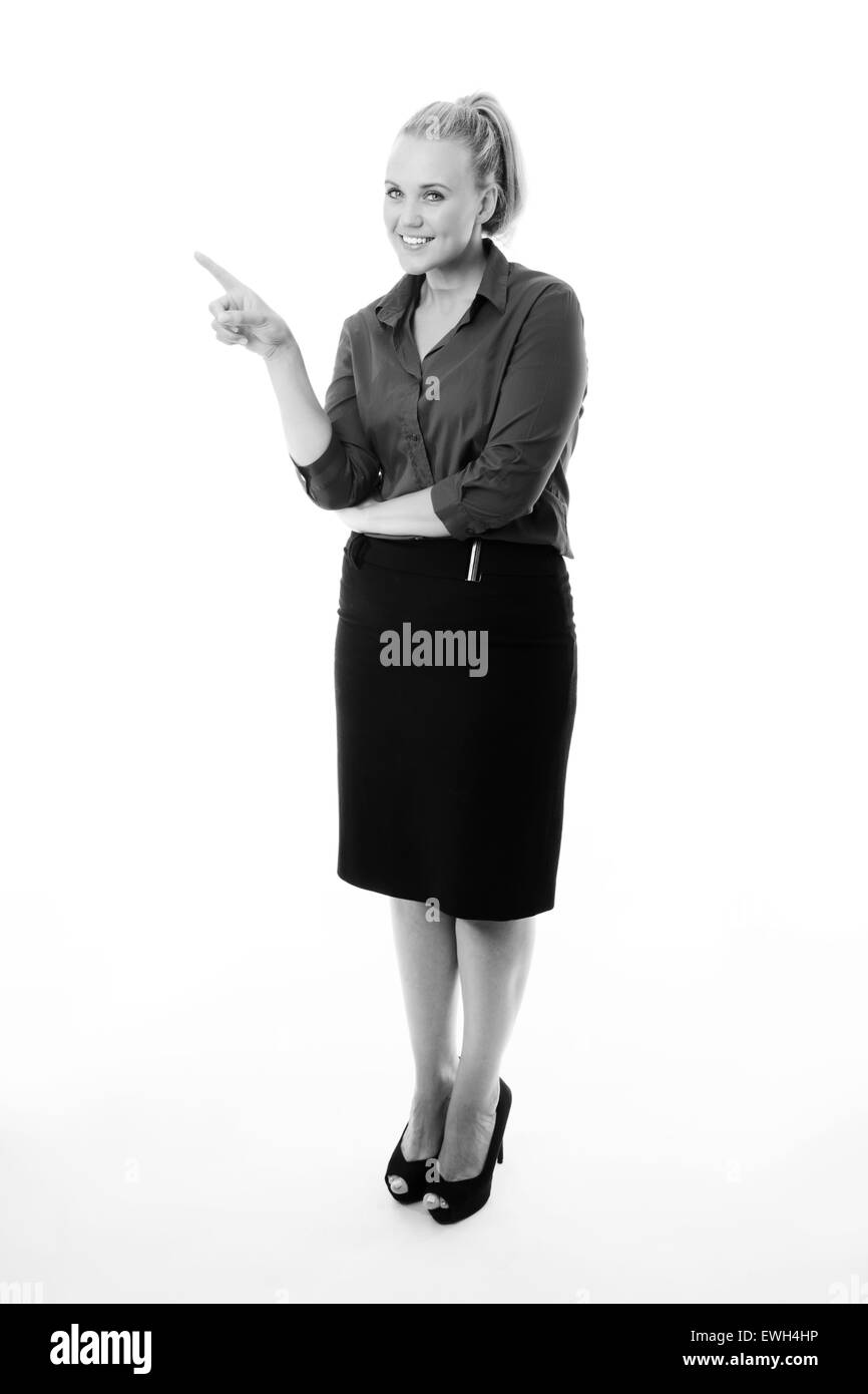 standing business woman pointing at a empty space Stock Photo