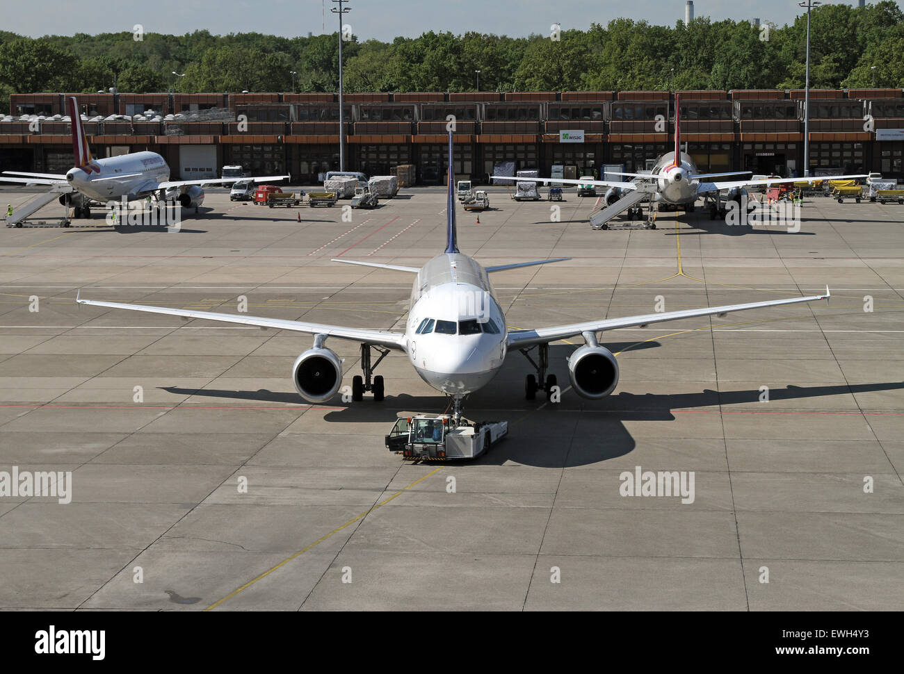 Berlin, Germany, Airbus A320, Lufthansa is pushed by a push-back vehicle Stock Photo