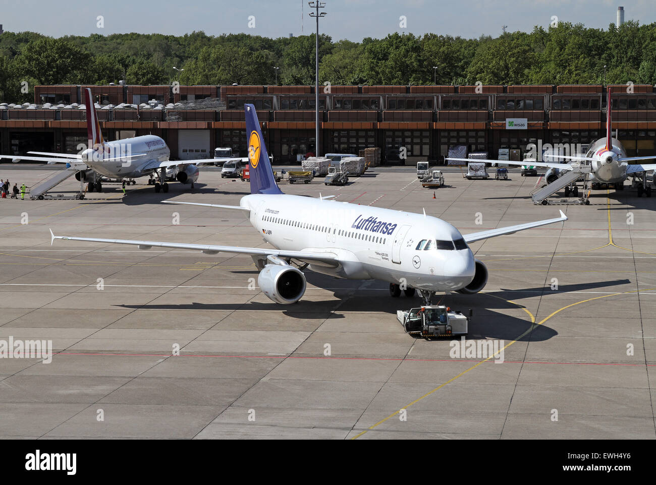 Berlin, Germany, Airbus A320, Lufthansa is pushed by a push-back vehicle Stock Photo