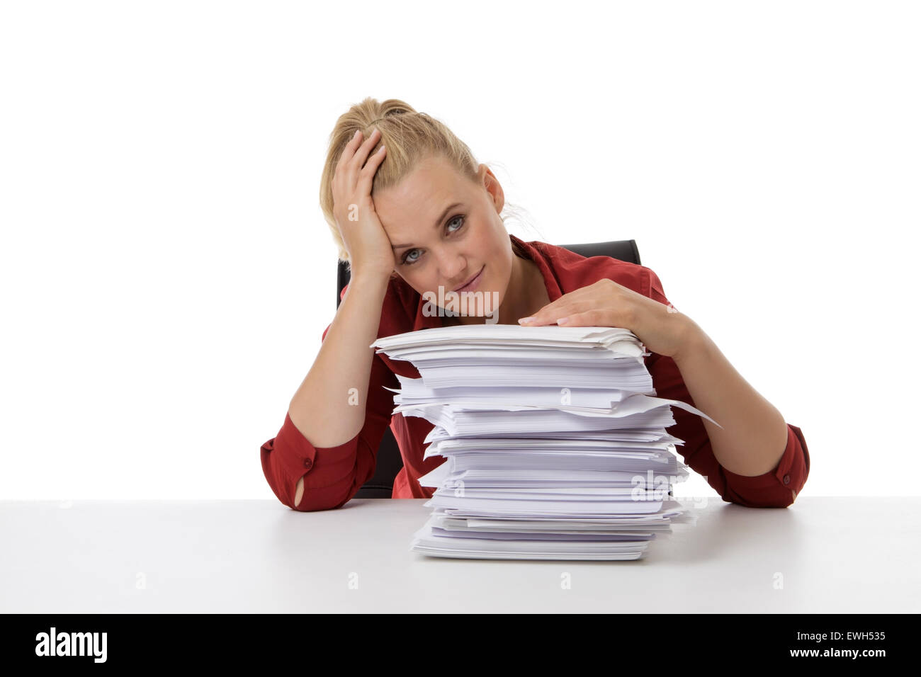 business woman looking at a stack of paper Stock Photo - Alamy