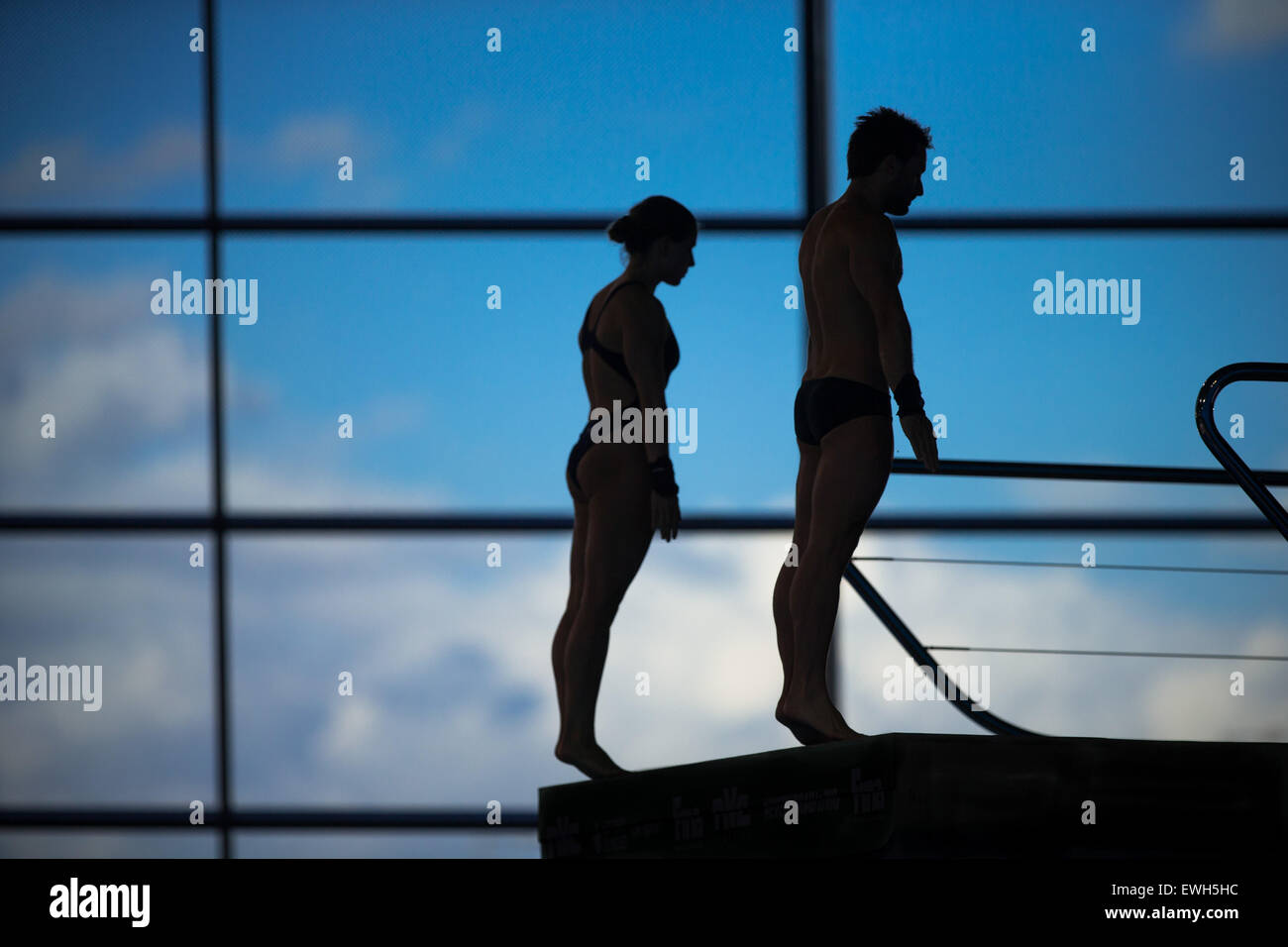 A pair of synchronised divers prepare during the Diving World Series in London, on May 3, 2015. Stock Photo