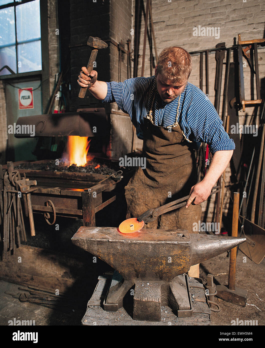 Hamburg, Germany, blacksmith hammering on anvil incandescent CDRom