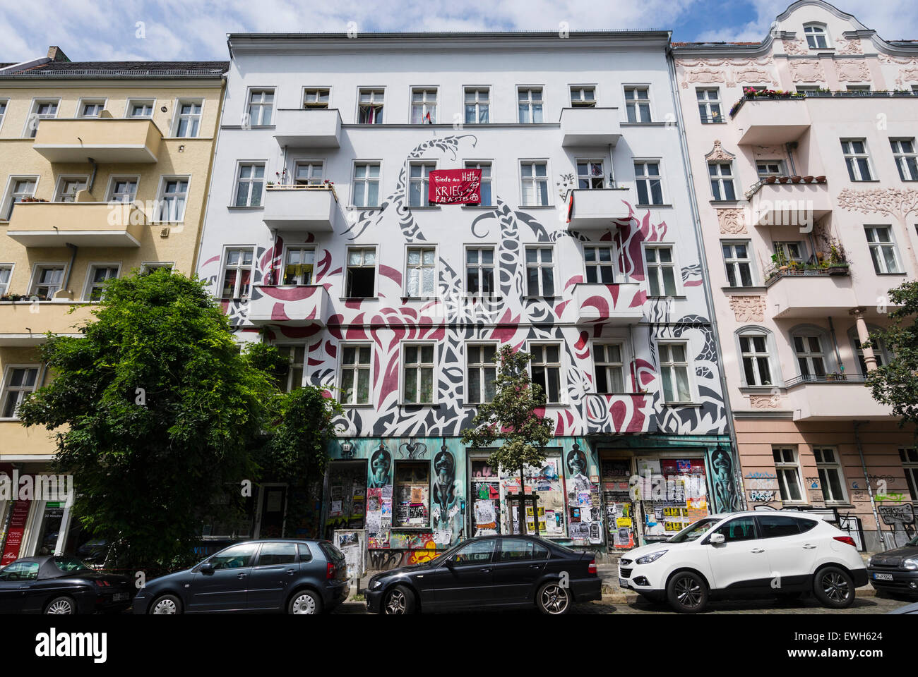 Tenement apartment building used as a squat in Friedrichshain district of Berlin Germany Stock Photo