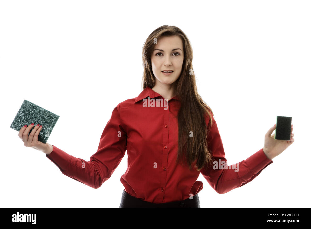 woman with outstretched hand holding two cleaning sponges Stock Photo