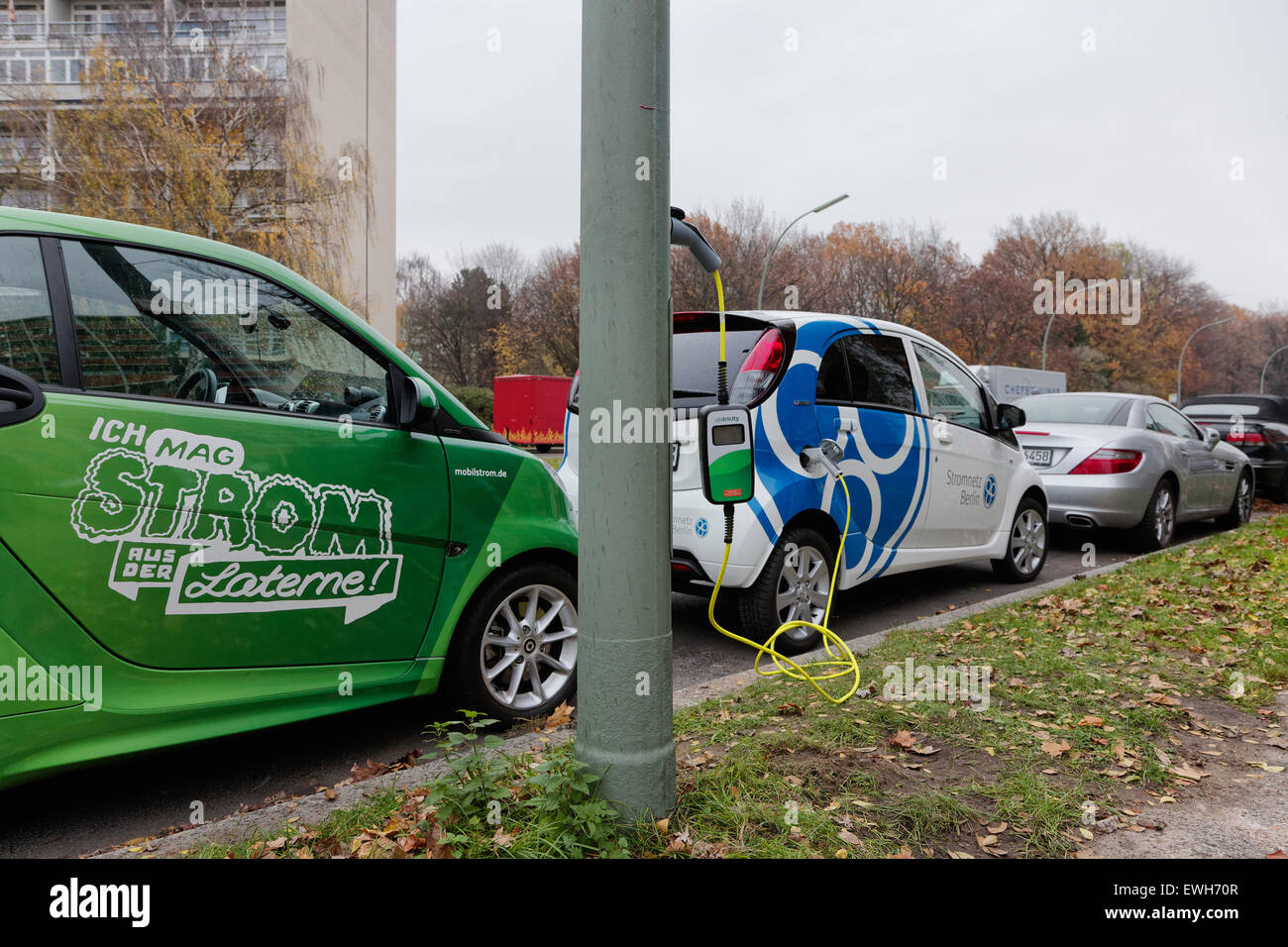 Berlin, Germany, invite an e-scooter over a street lantern Stock Photo