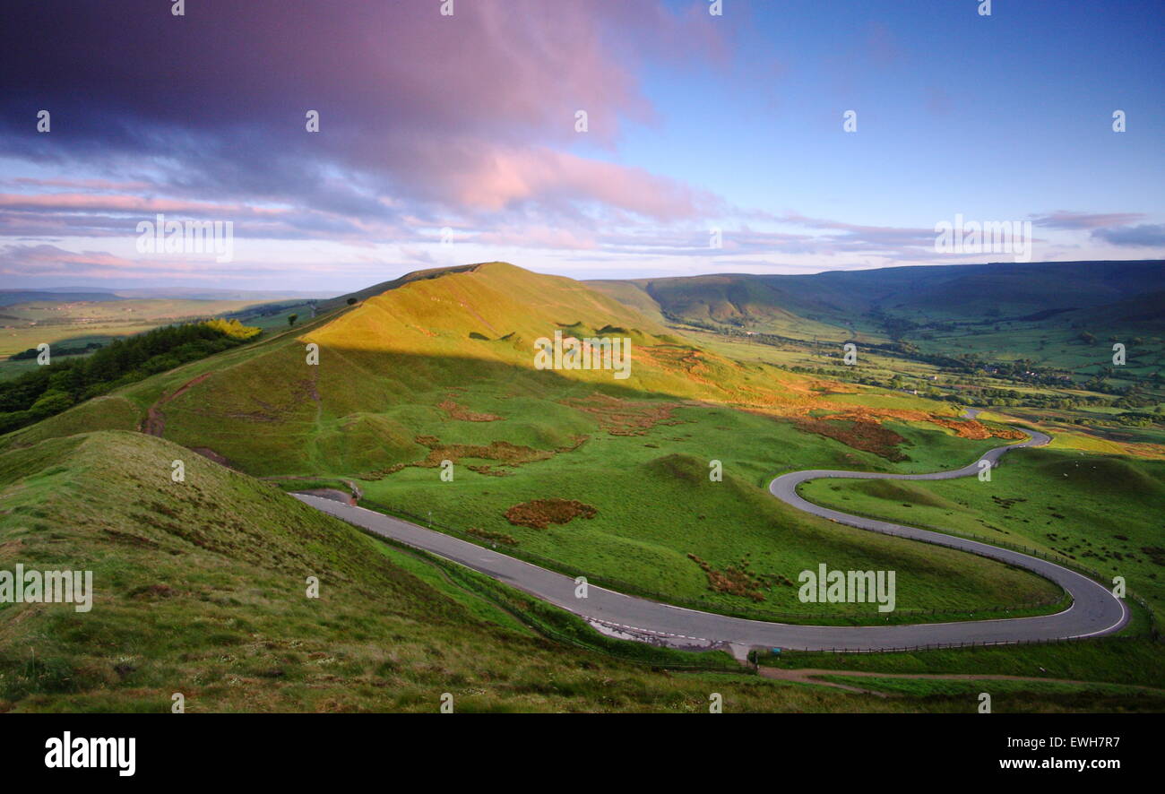 The winding B road to Edale across the Hope valley that slices Mam Tor and Rushup Edge, Peak District, Derbyshire England UK Stock Photo