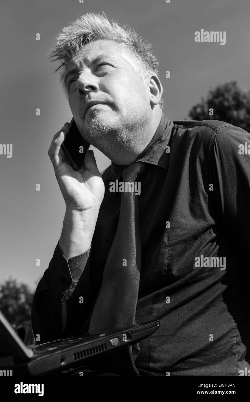 Businessman using phone working Black and White Stock Photos & Images ...