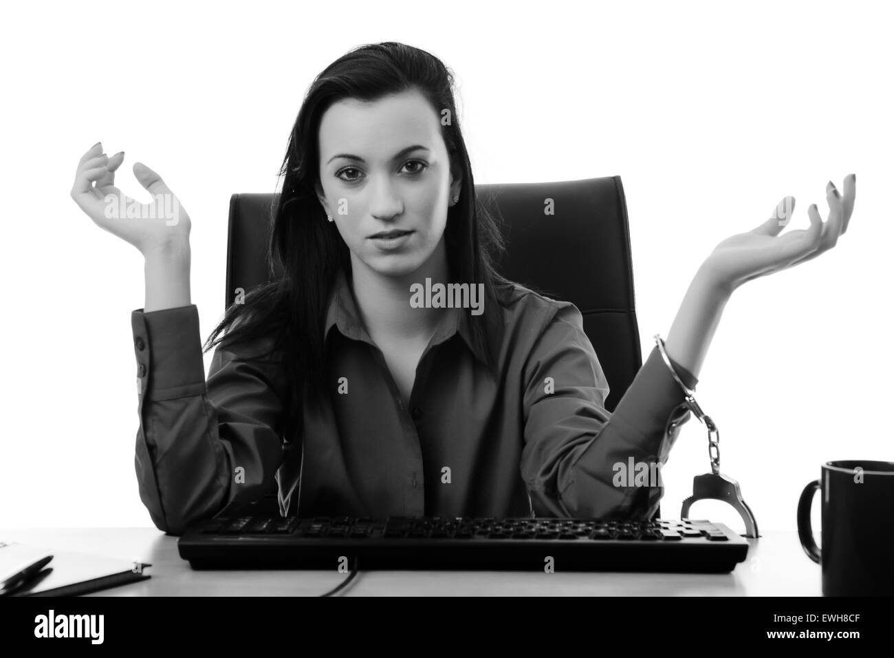 woman locked up to her desk at work Stock Photo Alamy