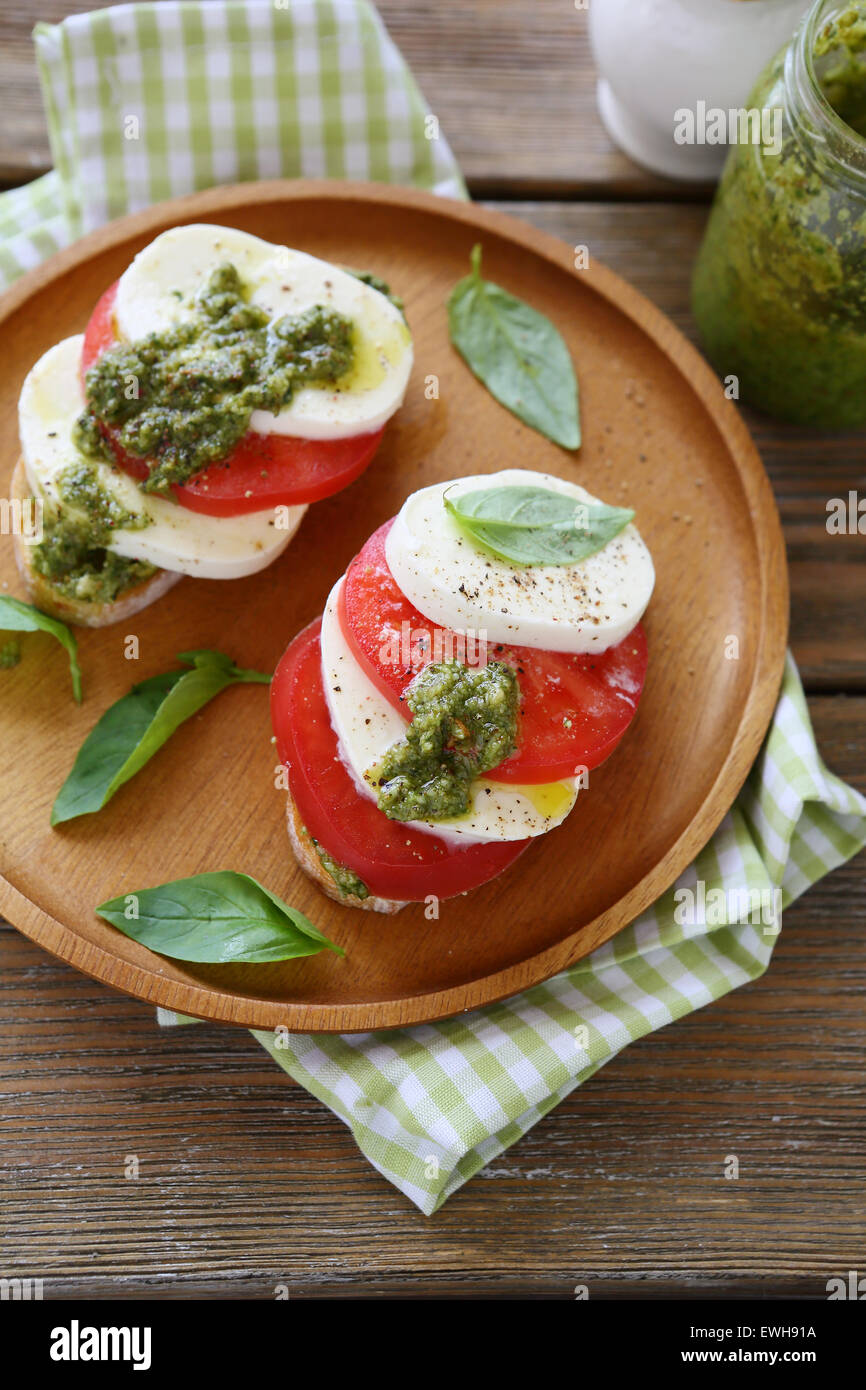 Bruschetta with mozzarella and pesto, food Stock Photo Alamy