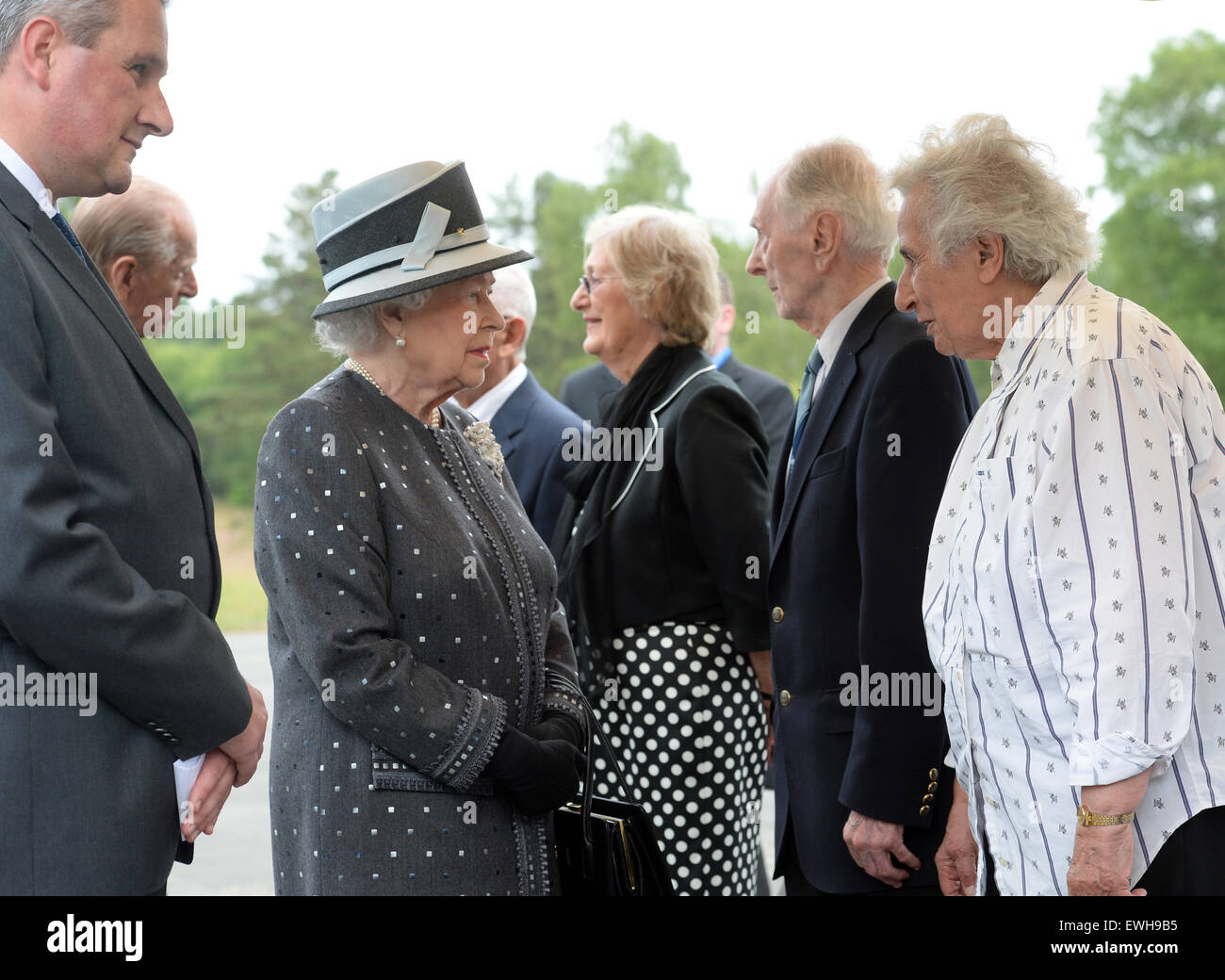Celle, Germany. 26th June, 2015. Britain's Queen Elizabeth II (C-L) and her husband Prince Philip (2-L) talk to contemporary witnesses (R-L) Anita Lasker-Wallfisch, Capt. Eric Brown and Doreen Levy during their visit at the site of former Bergen-Belsen concentration camp, in Bergen near Celle, Germany, 26 June 2015. Queen Elizabeth II and The Duke of Edinburgh are on their fifth state visit to Germany, taking place from 23 to 26 June. Photo: JULIAN STRATENSCHULTE/dpa Credit:  dpa picture alliance/Alamy Live News Stock Photo