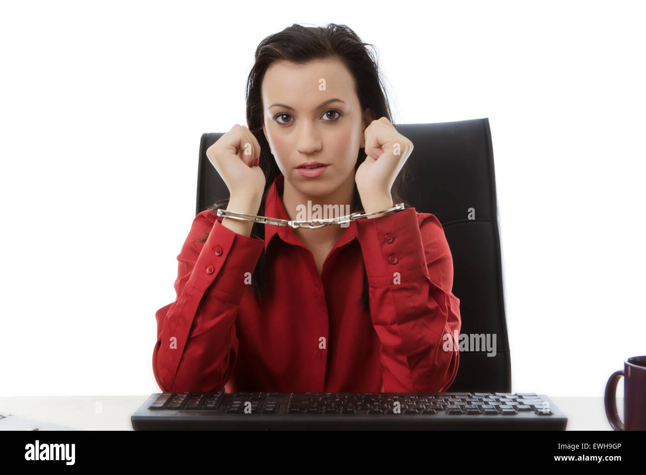 woman locked up to her desk at work Stock Photo Alamy