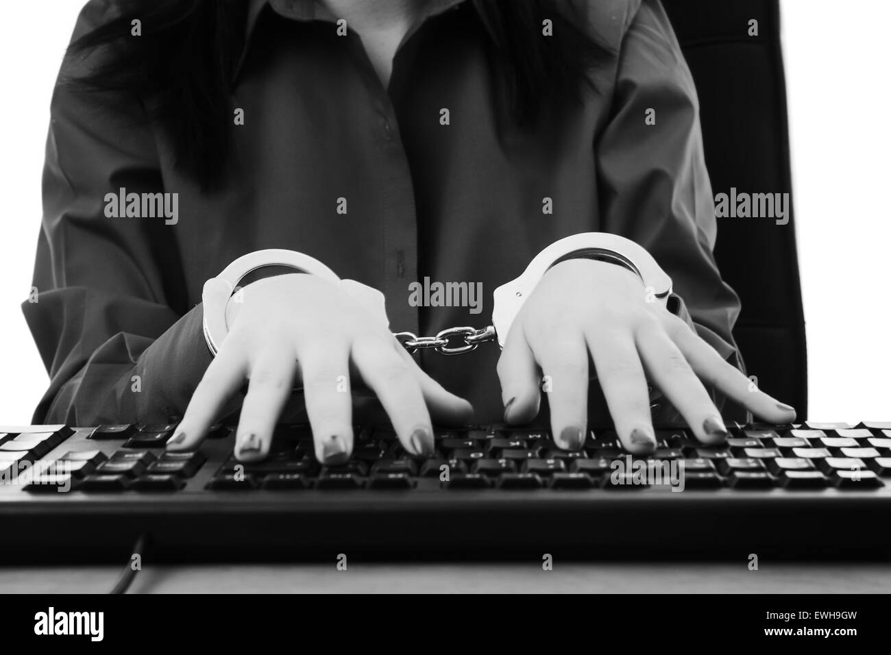woman locked up to her desk at work Stock Photo Alamy