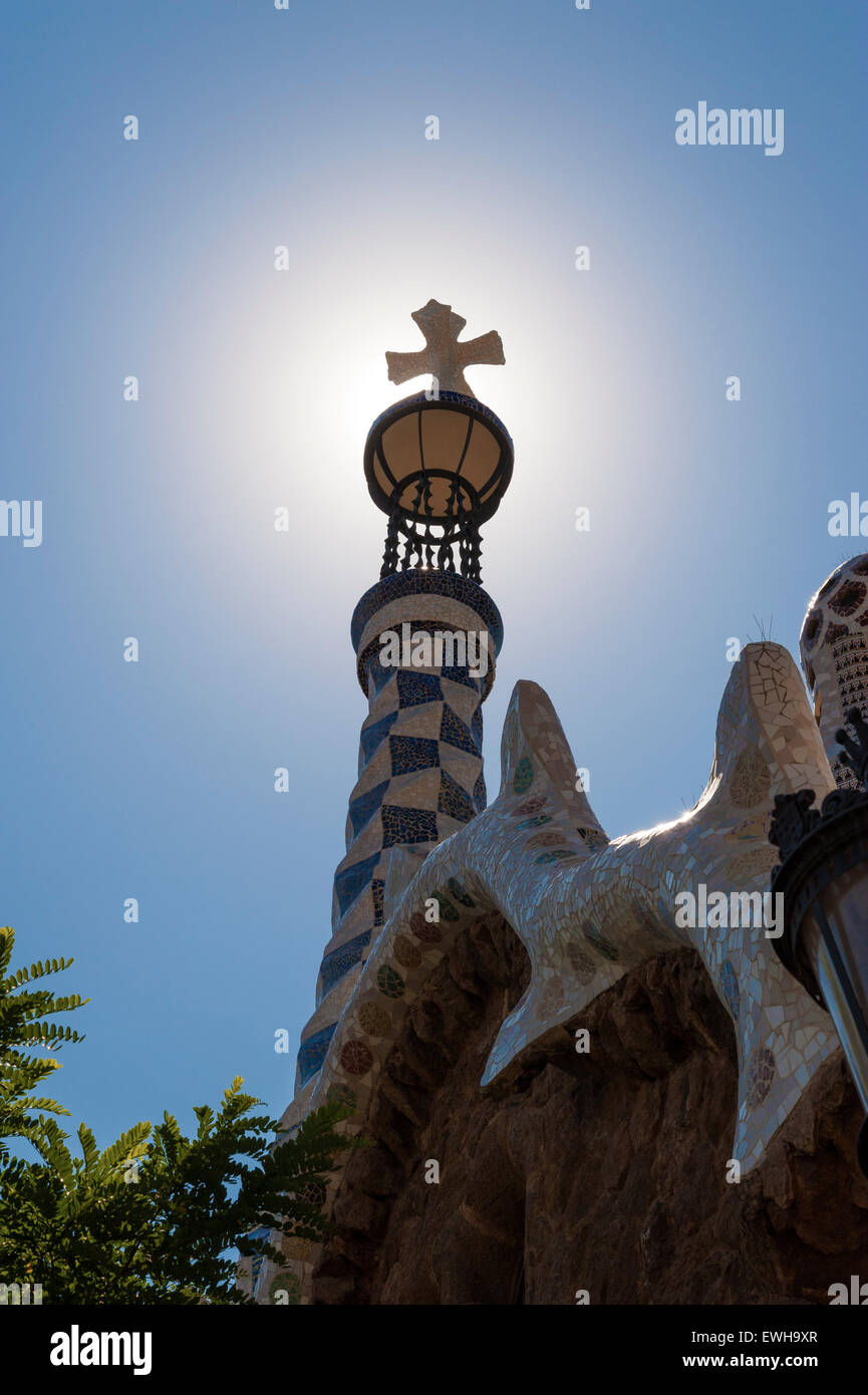 Backlit Cross in Parc Guell (Guell Park) in Barcelona, Spain. Designed by Antonio Gaudi Stock Photo