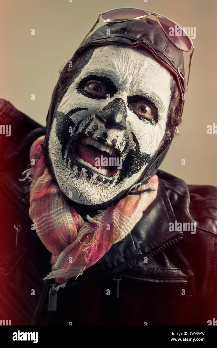 Angry aviator with face painted as human skull Stock Photo