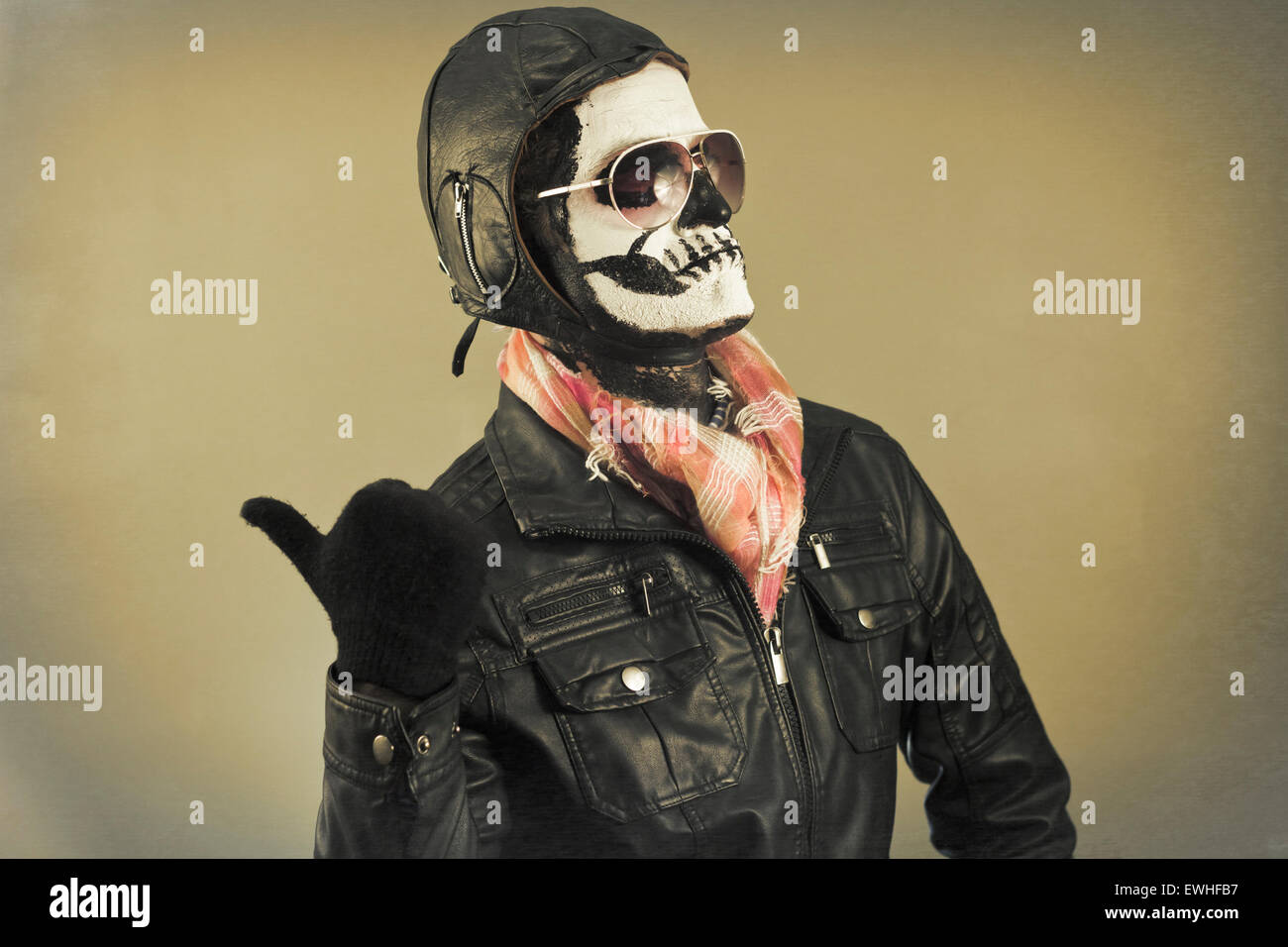 Blaming aviator with face painted as human skull Stock Photo