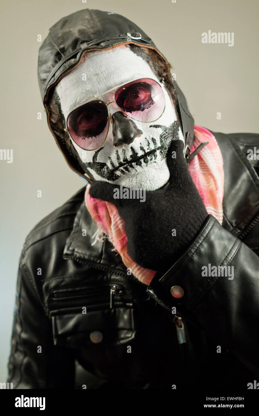 Thinking aviator with face painted as human skull Stock Photo