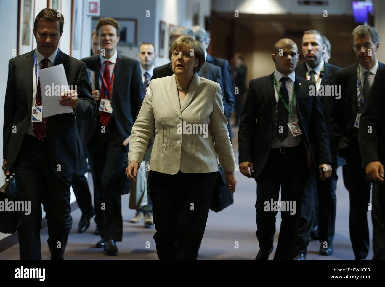 Brussels, Belgium. 26th June, 2015. German Chancellor Angela Merkel (C) arrives at a news conference after the European Union leaders summit in Brussels, Belgium, June 26, 2015. Credit:  Ye Pingfan/Xinhua/Alamy Live News Stock Photo