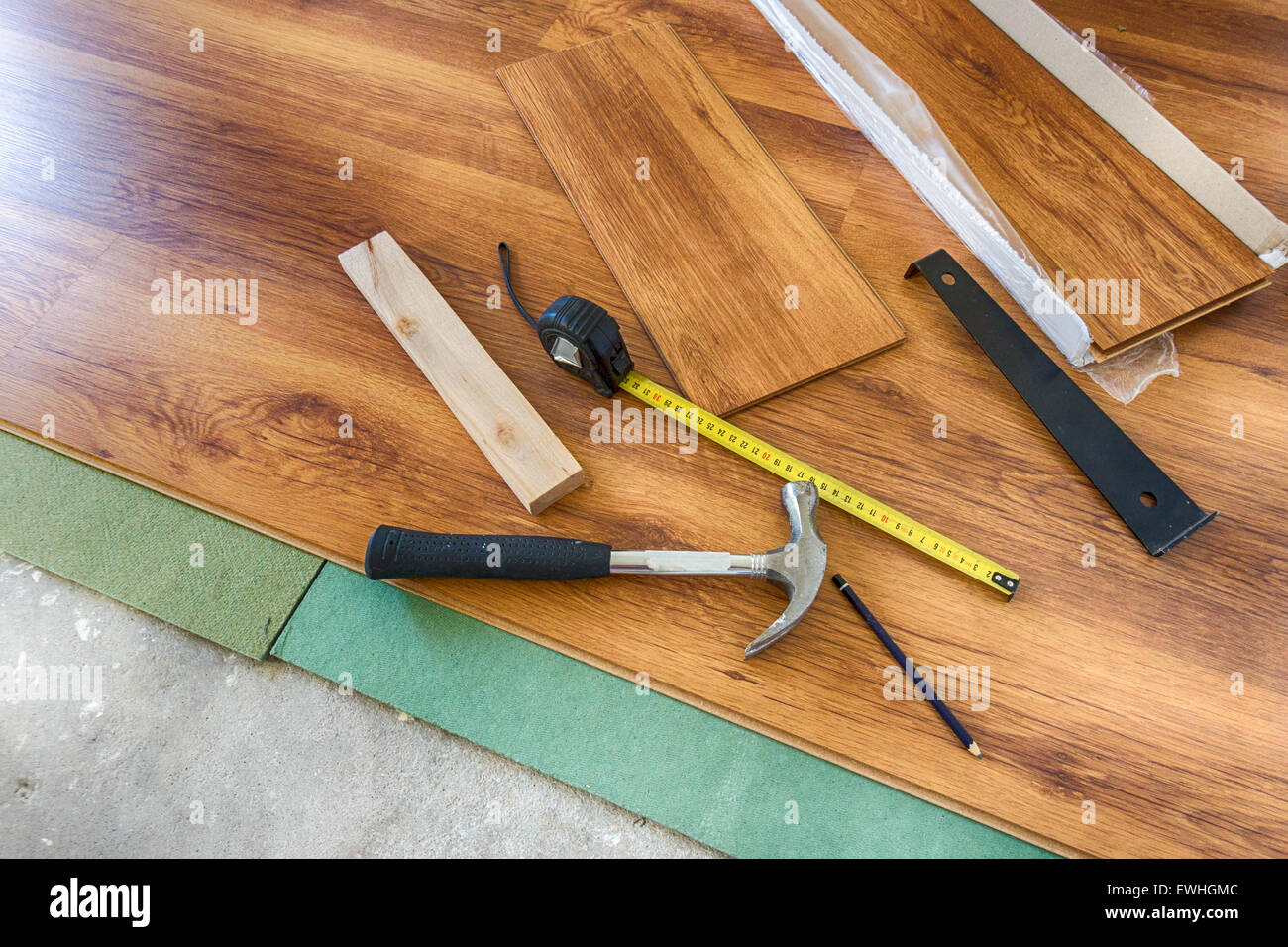 Installing new laminated wooden floor Stock Photo