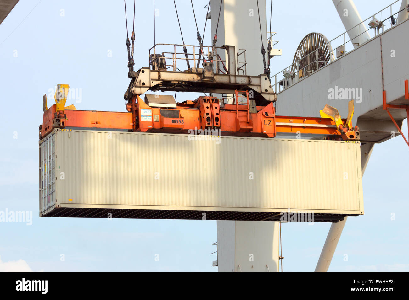 Sea container lifted by a harbor crane Stock Photo