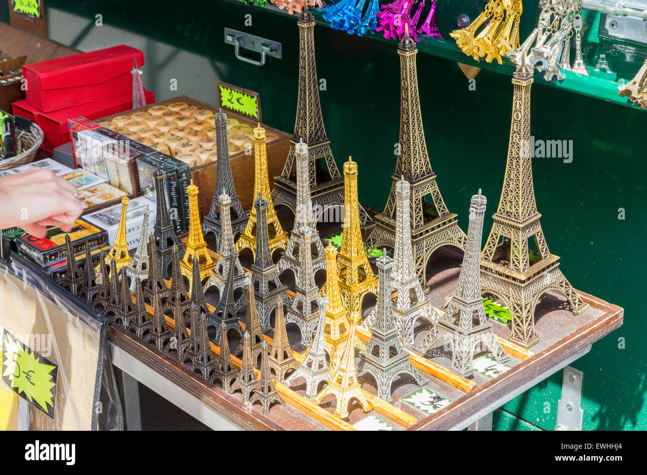 Small Eiffel tower souvenirs are being sold at a tourist stand in Paris, France. Stock Photo