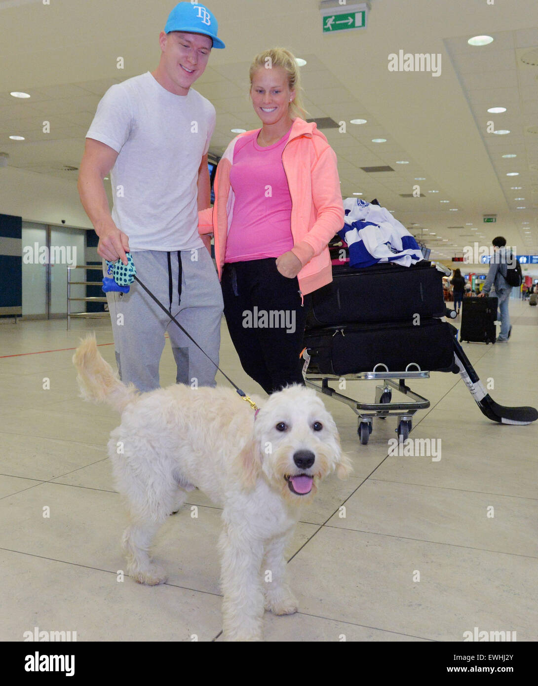 Prague, Czech Republic. 26th June, 2015. Hockey Stanley Cup finalist Ondrej  Palat of Tampa Bay arrives with his partner Barbora Bartikova and dog Snowy  in Prague, Czech Republic, June 26, 2015. ©