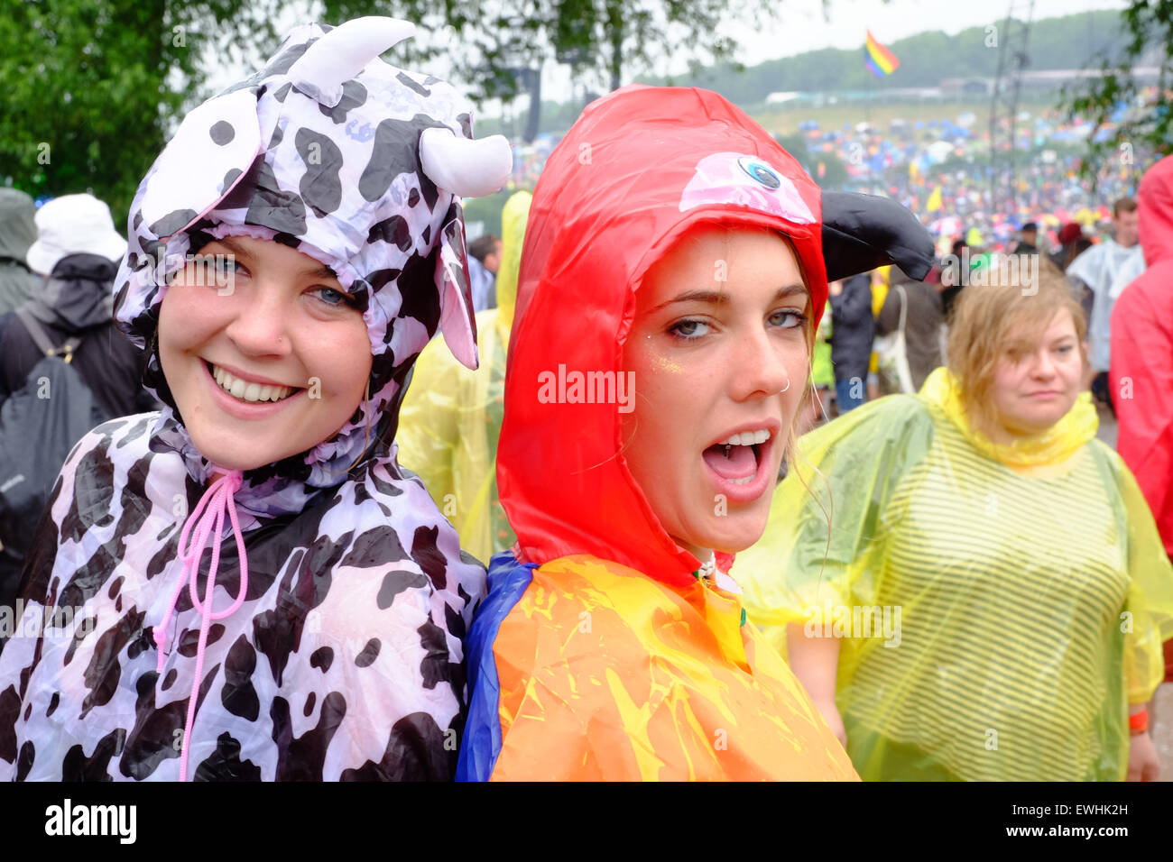 Glastonbury Festival, Somerset, UK. 26 June 2015. It would not be Glastonbury without some rain! Spirits stay high and the music continues despite a heavy mid afternoon downpour. Credit:  Tom Corban/Alamy Live News Stock Photo