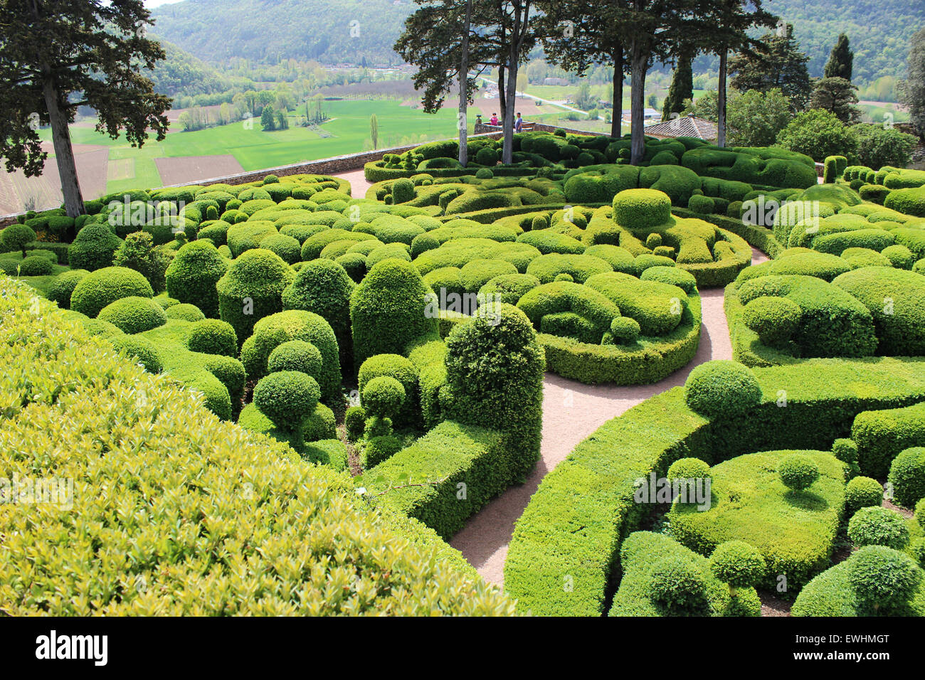 View of the Dordogne valley in the background of the creative and unusual topiary boxwood gardens Stock Photo