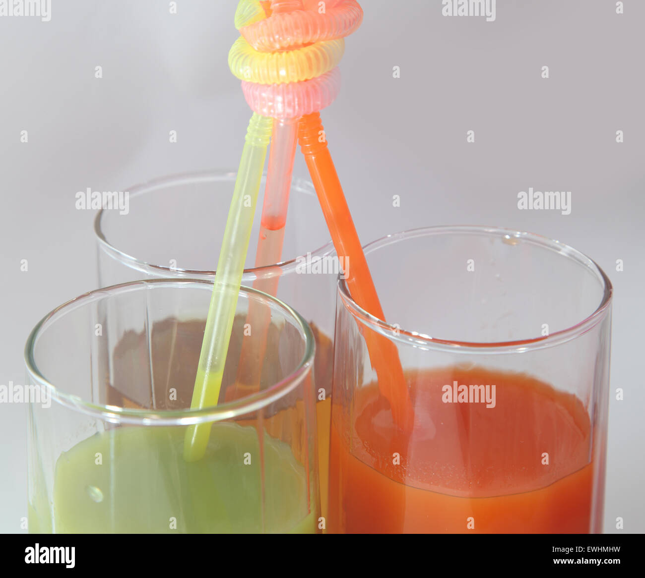 three glasses with juice Stock Photo - Alamy