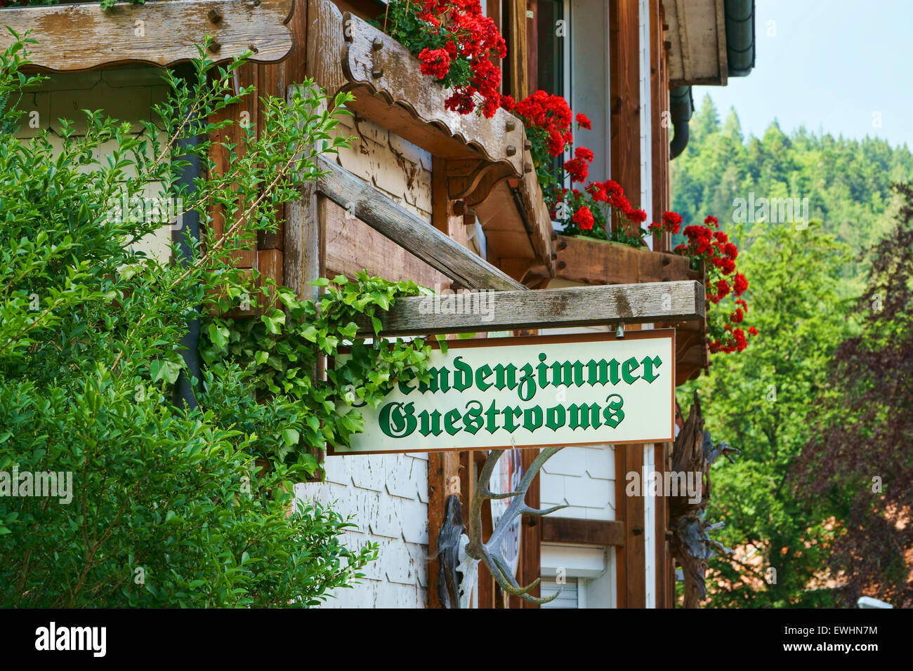 Guest Rooms Sign on wooden board on a guest house in the Black Forest Stock Photo