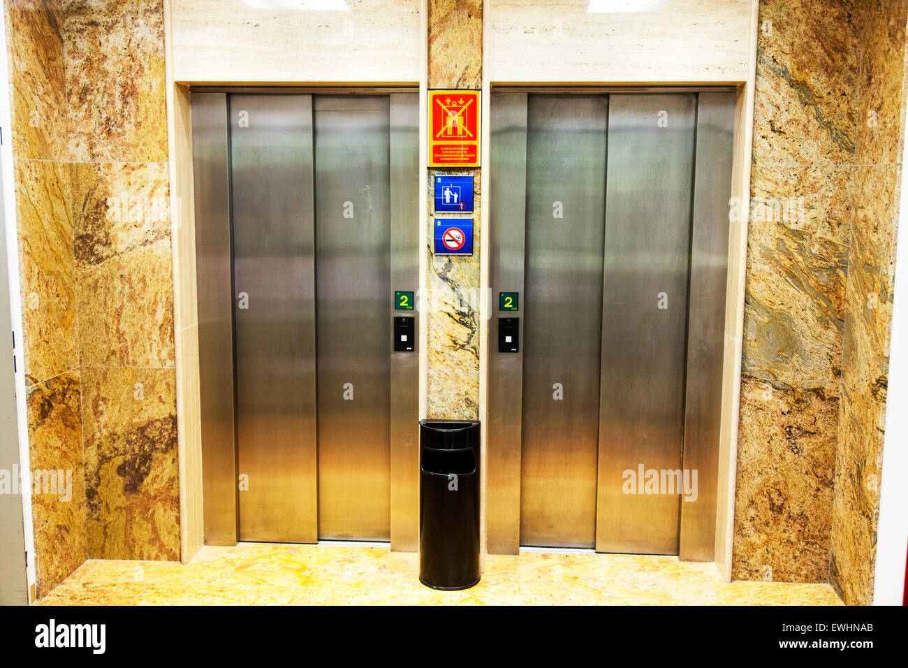 Elevator doors closed lift lifts elevators hotel floors two 2 shut Stock Photo