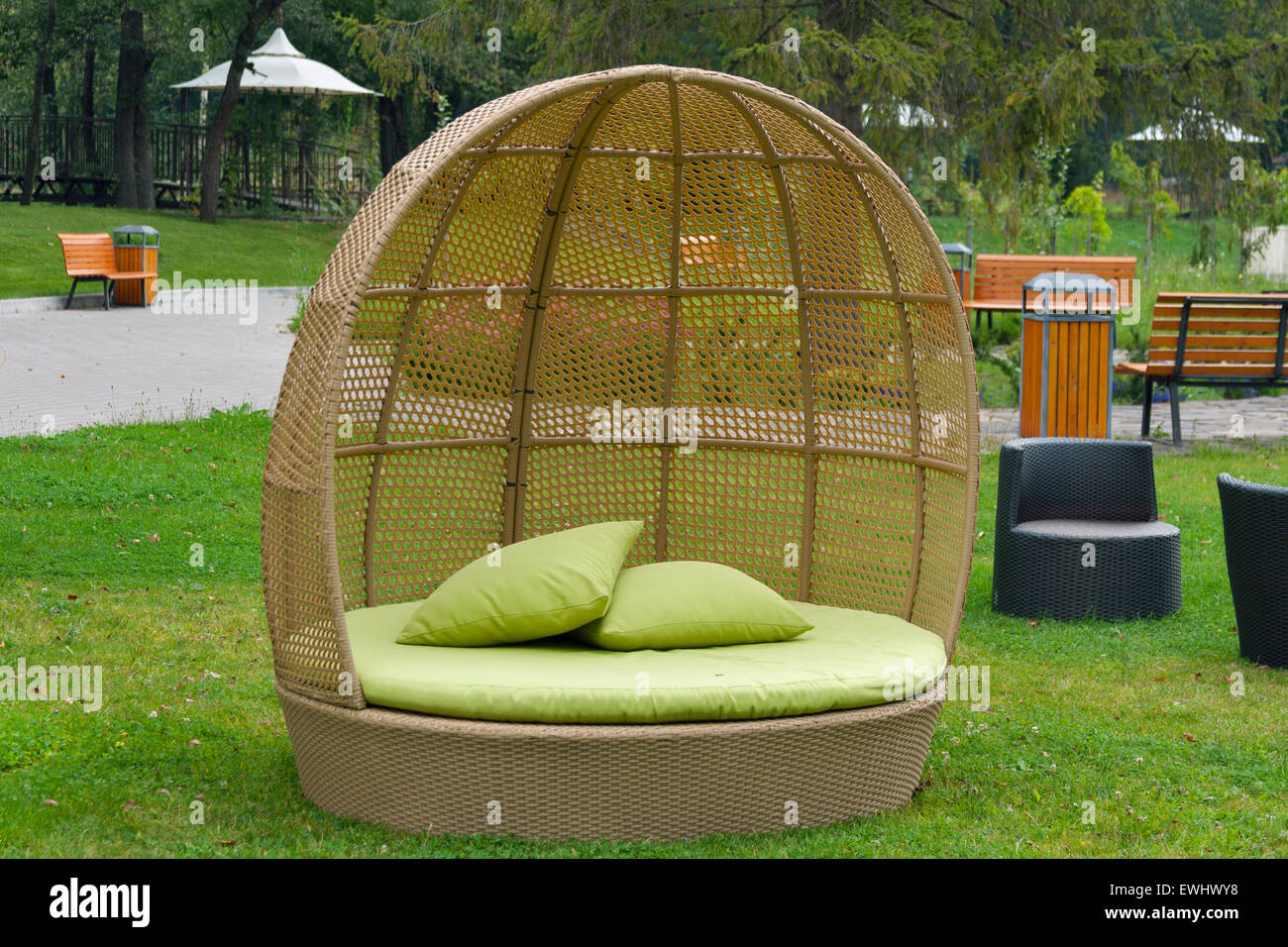 Half round modern furniture rattan wicker sofa in garden Stock Photo
