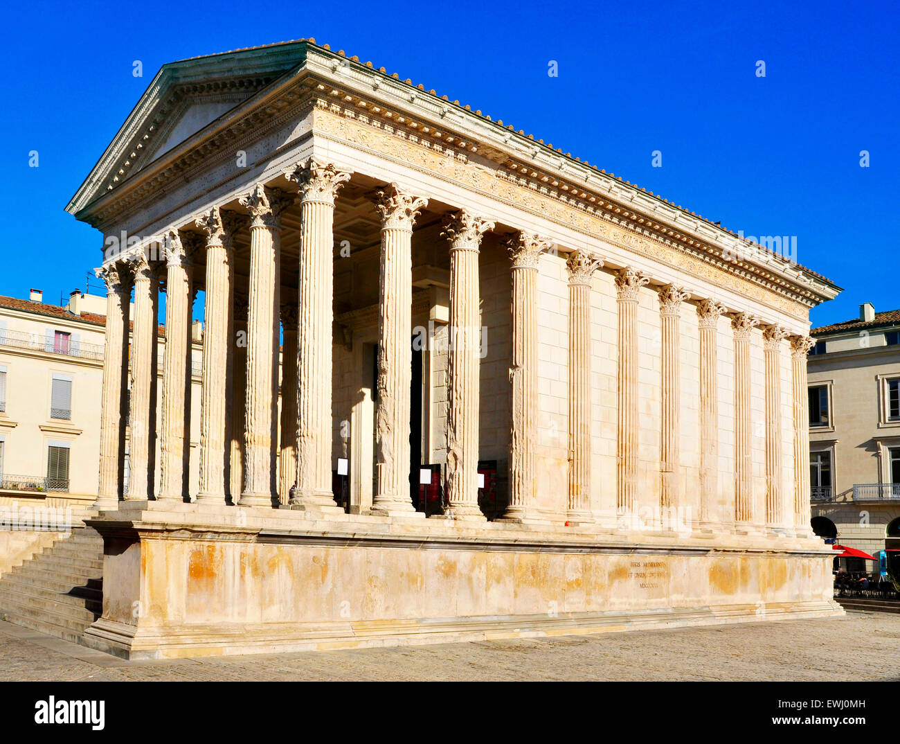 a lateral view of the ancient roman Maison Carree in Nimes, France Stock Photo